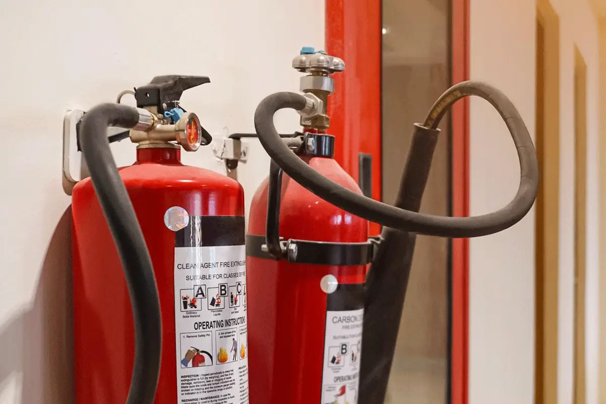 Fire extinguishers on wall that need to be recharged and refilled